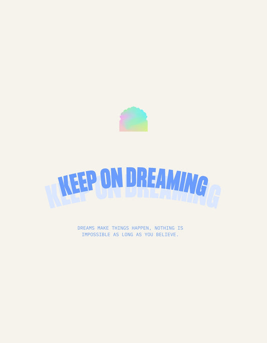 Ez a design egy szivárványos színátmenetes felhőt és motíváló szöveget tartalmaz, az "Keep On Dreaming" felirattal az előtérben, a lehetőségek végtelenségét sugallva. 