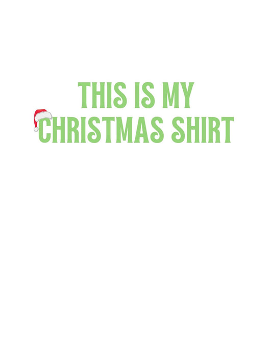 A képen egy vicces feliratos dizájn található, "THIS IS MY CHRISTMAS SHIRT" szöveggel, mely egy karácsonyi sapkát viselő betűre helyez egy kis ünnepi hangulatot. 