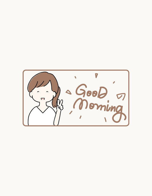 Egy mosolygós karakter köszönti a reggelt a "Good Morning" felirattal, amely a pozitív napszakkezdést szimbolizálja. 