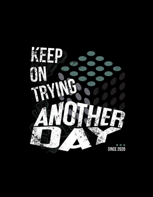 Motiváló üzenettel díszített grafika, mely a "Keep on trying, another day" szavakat tartalmazza fehér és kék árnyalatokban egy sötét háttér előtt, hangsúlyos, texturált betűkkel. 